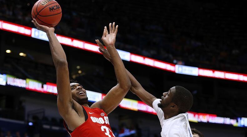 NEW ORLEANS, LA - DECEMBER 23: Keita Bates-Diop #33 of the Ohio State Buckeyes shoots against Brandon Robinson #4 of the North Carolina Tar Heels during the first half of the CBS Sports Classic at the Smoothie King Center on December 23, 2017 in New Orleans, Louisiana. (Photo by Jonathan Bachman/Getty Images)