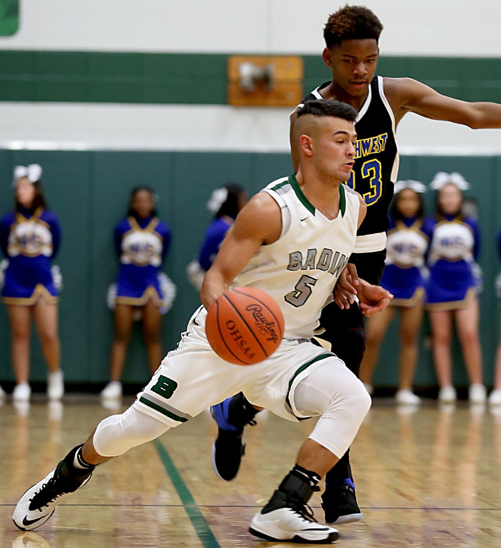 Badin guard Daunte DeCello is covered by Northwest guard Tyree McKinney during their game at Mulcahey Gym in Hamilton on Wednesday night. CONTRIBUTED PHOTO BY E.L. HUBBARD