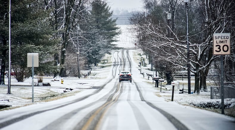 Snow caused slick roads and several school delays in Butler County Thursday, Feb. 13, 2020. This is Paullin Drive in Wayne Township. NICK GRAHAM / STAFF