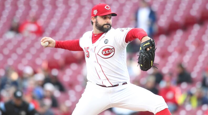 Reds starter Tanner Roark pitches against the Brewers on Monday, April 1, 2019, at Great American Ball Park in Cincinnati. David Jablonski/Staff