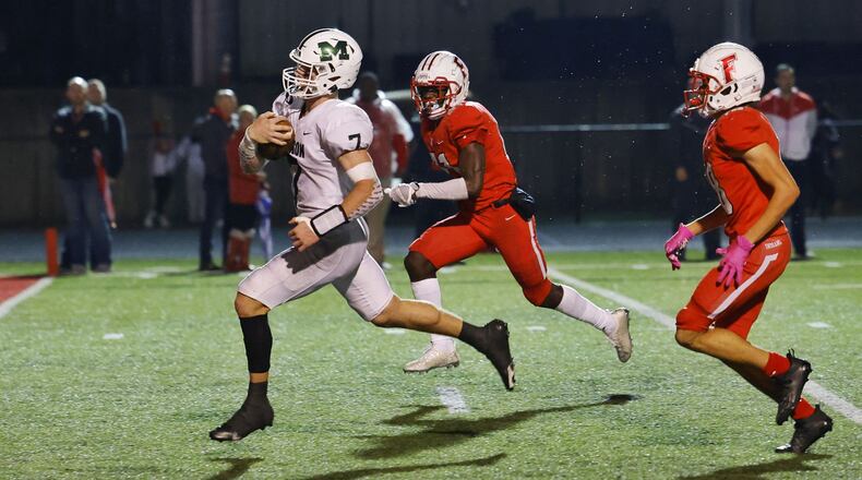 Mason quarterback Michael Molnar runs for a touchdown during their Division I playoff game against Fairfield Friday, Oct. 29, 2021at Fairfield Stadium. Fairfield won 28-21. NICK GRAHAM/STAFF