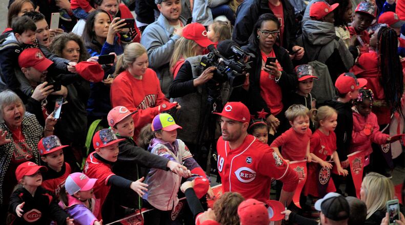 Joey Votto, of the Cincinnati Reds, walks the red carpet on Kids Day at Great American Ball Park on Saturday, March 30, 2019, in Cincinnati.