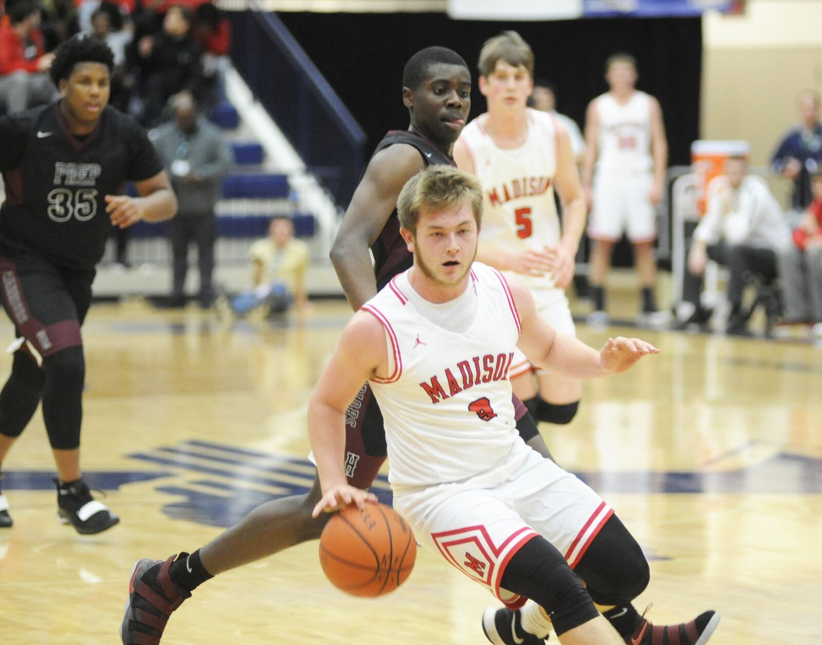 Madison’s Mason Whiteman dribbles up the floor Monday night against Canal Winchester Harvest Prep during Flyin’ to the Hoop at Fairmont’s Trent Arena. Harvest Prep won 79-56. MARC PENDLETON/STAFF