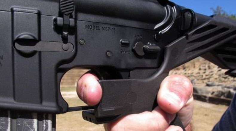 An AR-15 rifle fitted with a bump stock. FILE PHOTO