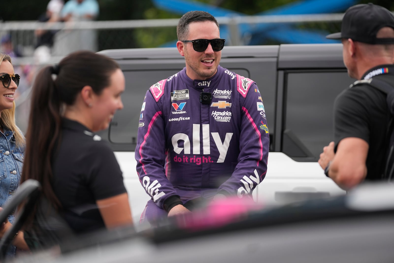 Driver Alex Bowman (48) talks with people before in a NASCAR Cup Series auto race at the Grant Park 220, Sunday, July 6, 2025, in Chicago. (AP Photo/Erin Hooley)