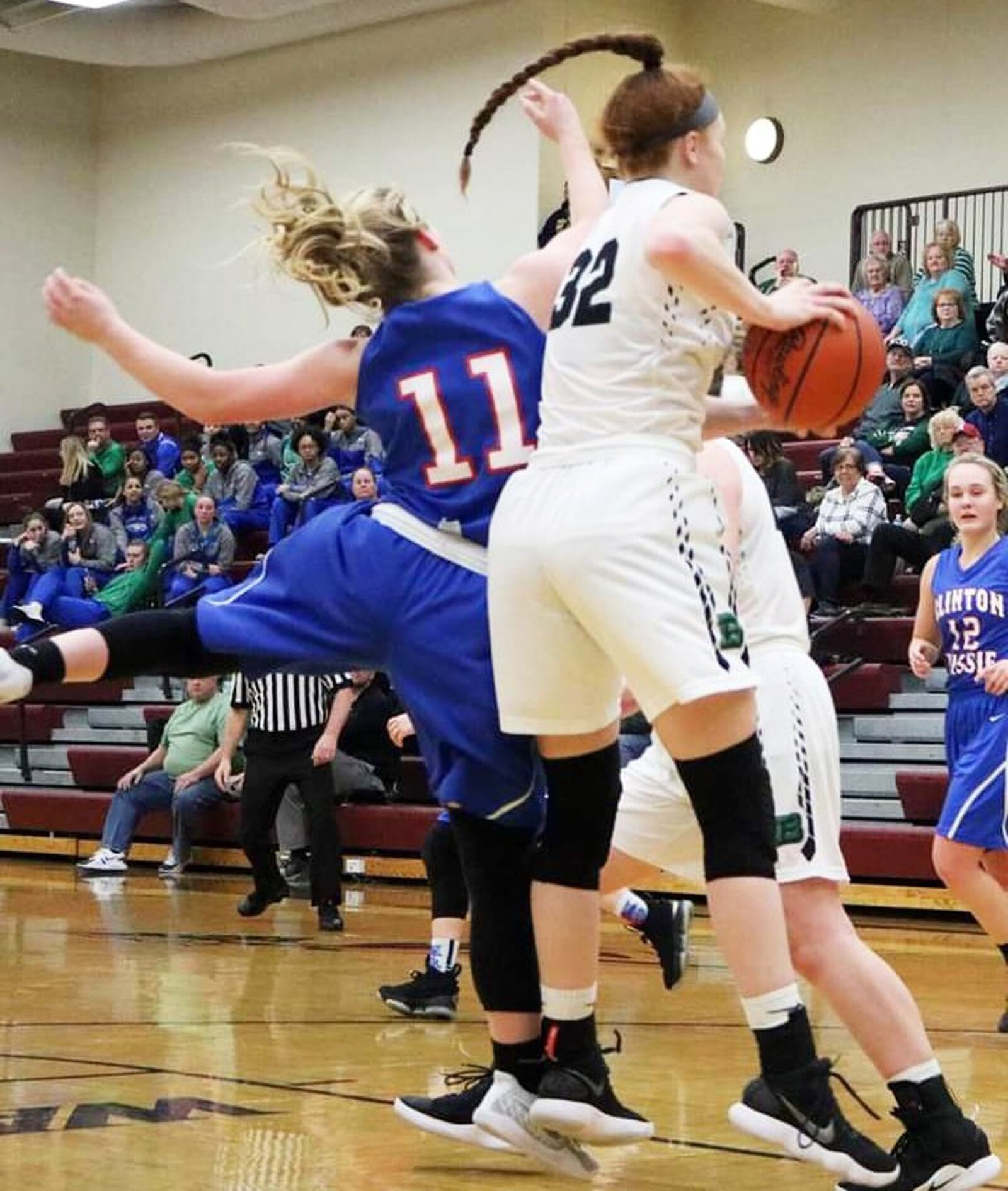 Badin’s Mickayla Kowalski (32) beats Clinton-Massie’s Natalie Lay (11) for a rebound during Saturday afternoon’s Division II sectional opener at Lebanon. Badin won 54-10. CONTRIBUTED PHOTO BY TERRI ADAMS