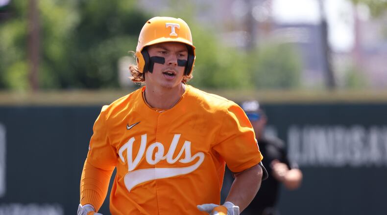 Tennessee's Jordan Beck rounds the bases after hitting a three-run home run against Notre Dame in the fifth inning during an NCAA college baseball super regional game Saturday, June 11, 2022, in Knoxville, Tenn. (AP Photo/Randy Sartin)