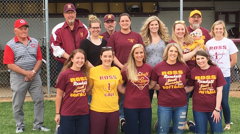 Members of Ross High School’s 2009 Division II state championship softball team pose for a photo before Wednesday’s game against visiting Northwest. STAFF