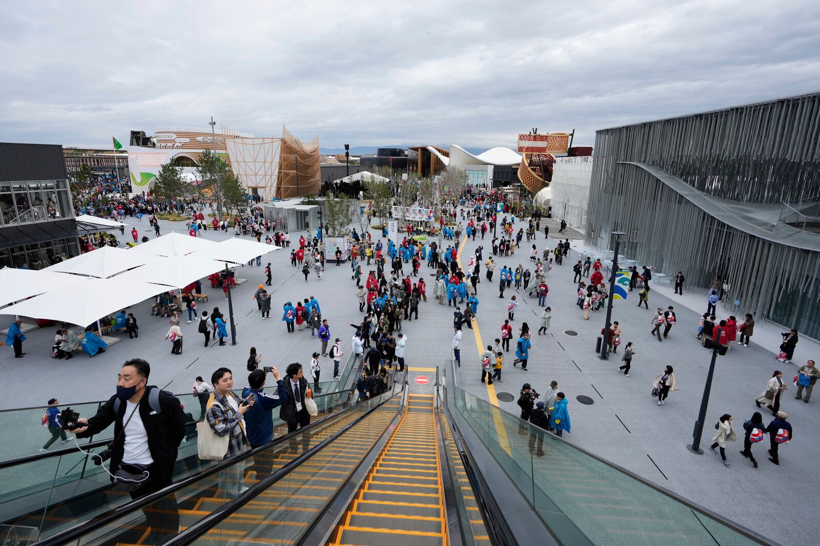 People visit the opening day of the Expo 2025 in Osaka, central Japan, Sunday, April 13, 2025. (AP Photo/Hiro Komae)