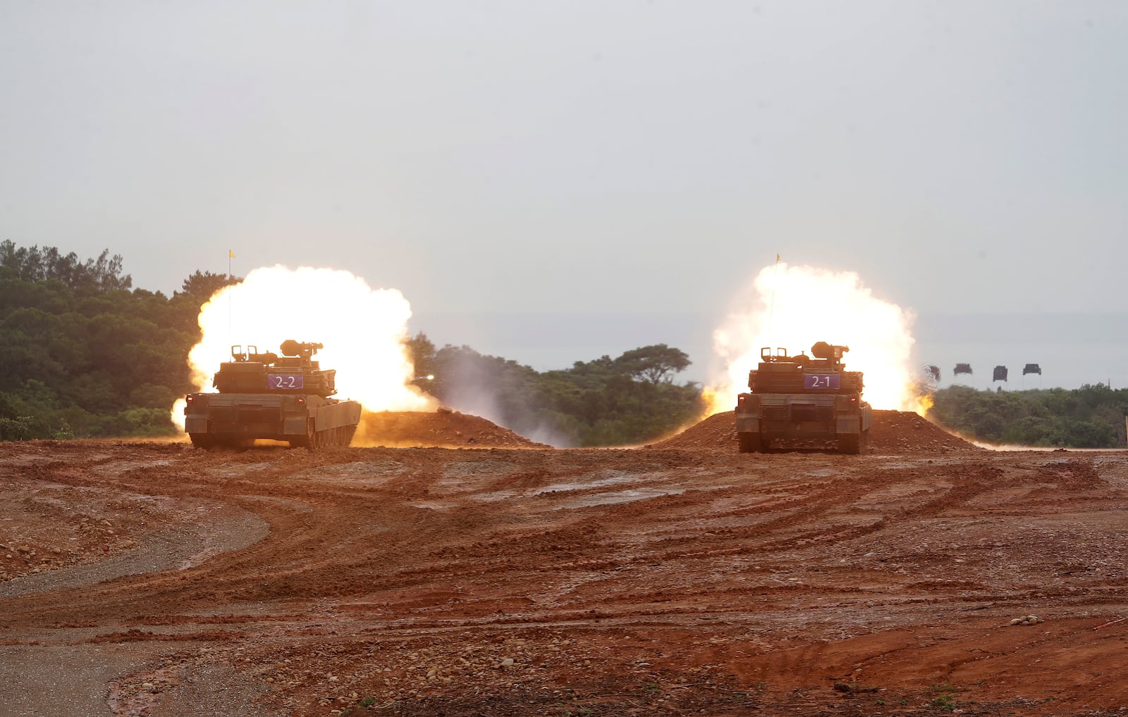M1A2T Abrams main battle tanks fire during a military live-fire shooting training in Hsinchu County, Taiwan, Thursday, July 10, 2025. (AP Photo/Chiang Ying-ying)