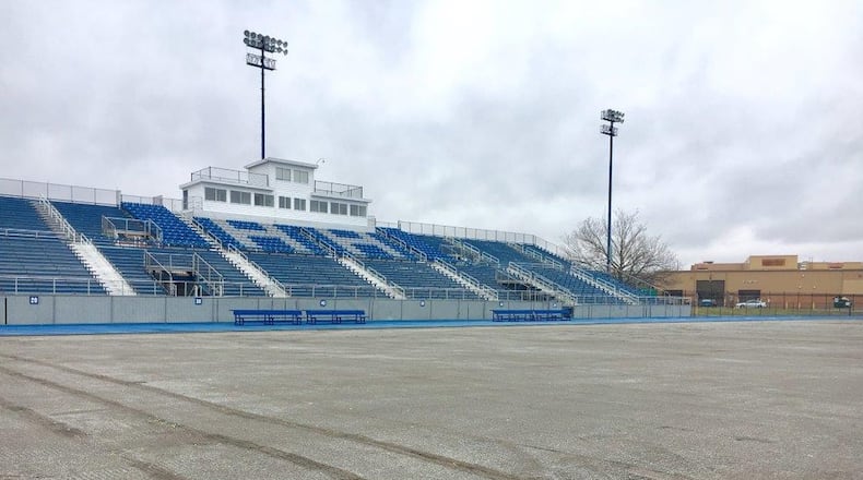The old artificial turf at Hamilton High School’s Virgil M. Schwarm Stadium has been rolled up as part of a $400,000 replacement project. The new turf will cover a larger area and have new features. The work is expected to be done by March 1. MICHAEL D. PITMAN/STAFF