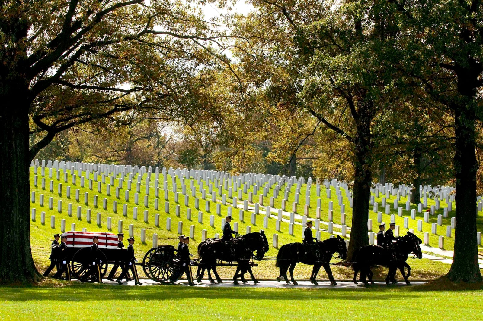 FILE - A U.S. Army Caisson team carries the remains of Army Pfc. Tramaine J. Billingsley during burial services at Arlington National Cemetery in Arlington, Va., Nov. 2, 2010. (AP Photo/Kevin Wolf, File)