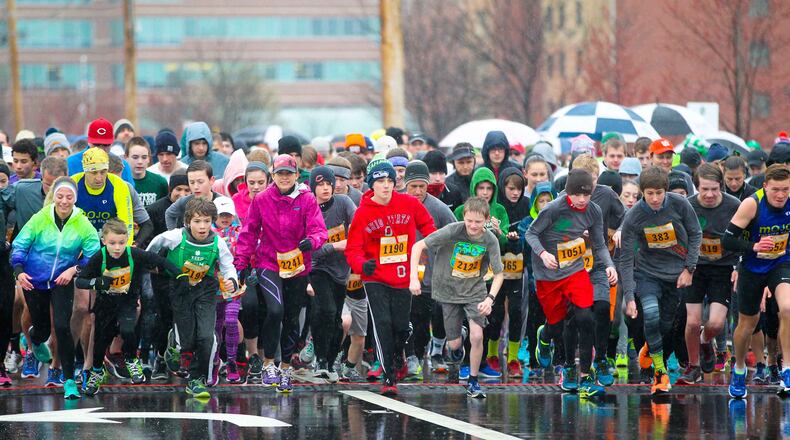 Runners participate in the 10th annual Shamrock Shuffle at the The Square @ Union Centre in West Chester Twp. Saturday, Mar. 19, 2016. GREG LYNCH / STAFF