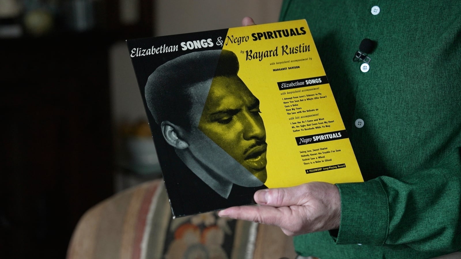 In this still image taken from video, Walter Naegle, Bayard Rustin's partner and a consultant on projects related to his life and work, holds a vinyl record in his home on Saturday, June 28, 2025, in New York. (AP Photo/Mary Conlon)