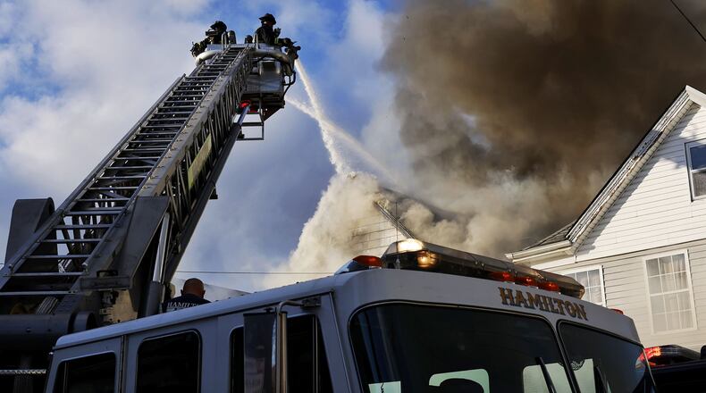 Multiple callers reported a Hanover Street house fire on Friday afternoon, Nov. 18, 2022, in Hamilton. NICK GRAHAM/STAFF