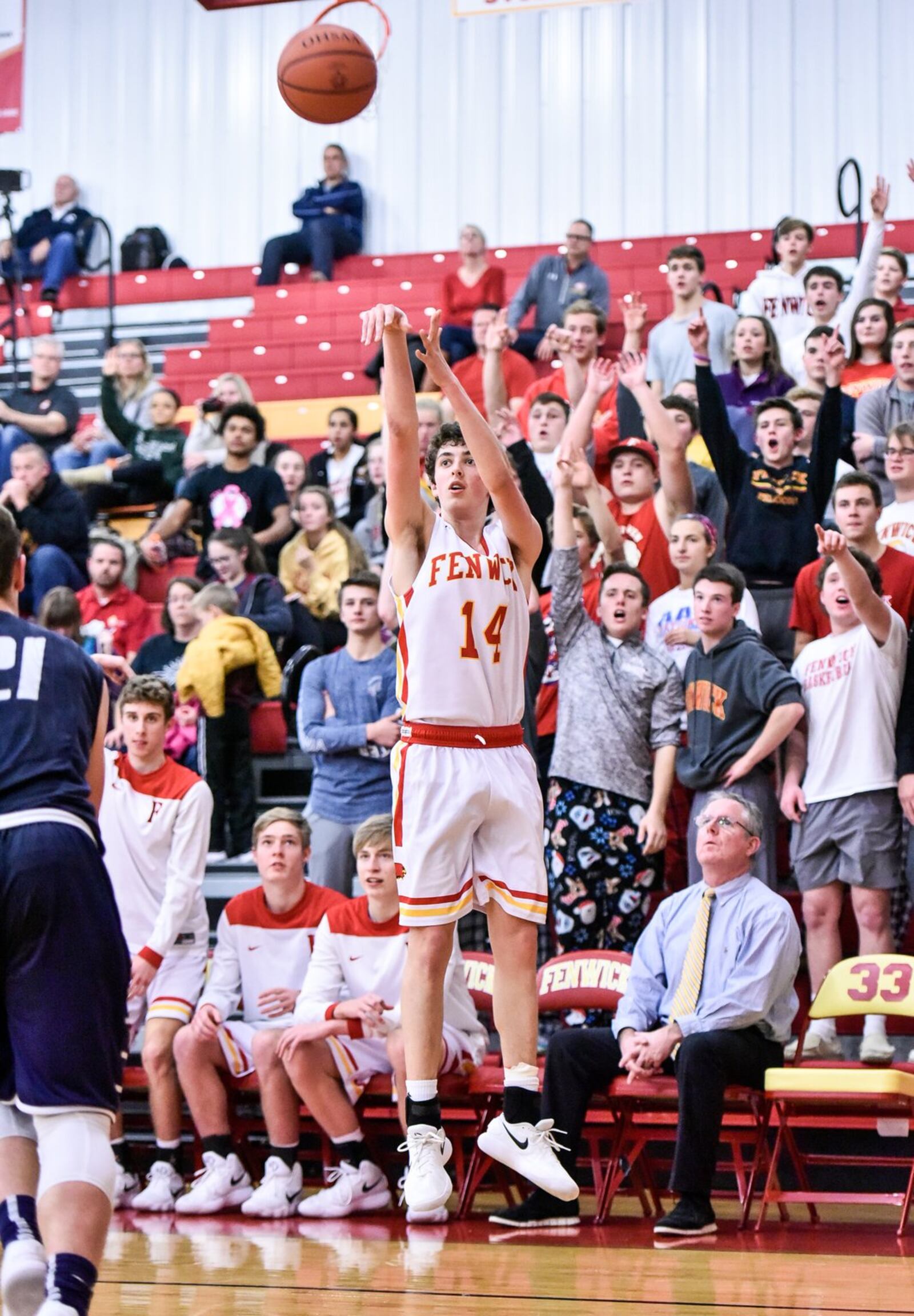 Fenwick’s Nick Braun puts up a long-range jumper during Tuesday night’s game against visiting Edgewood. NICK GRAHAM/STAFF