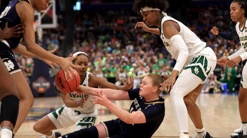 TAMPA, FLORIDA - APRIL 07: Abby Prohaska #12 of the Notre Dame Fighting Irish attempts to pass the ball to teammate Mikayla Vaughn #30 against the Baylor Lady Bears during the second quarter in the championship game of the 2019 NCAA Women's Final Four at Amalie Arena on April 07, 2019 in Tampa, Florida. (Photo by Mike Ehrmann/Getty Images)
