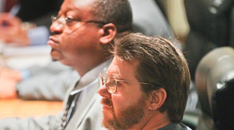 Attorney Ben Swift, left, is applying to have his law license reinstated by the Ohio Supreme Court. GREG LYNCH / STAFF