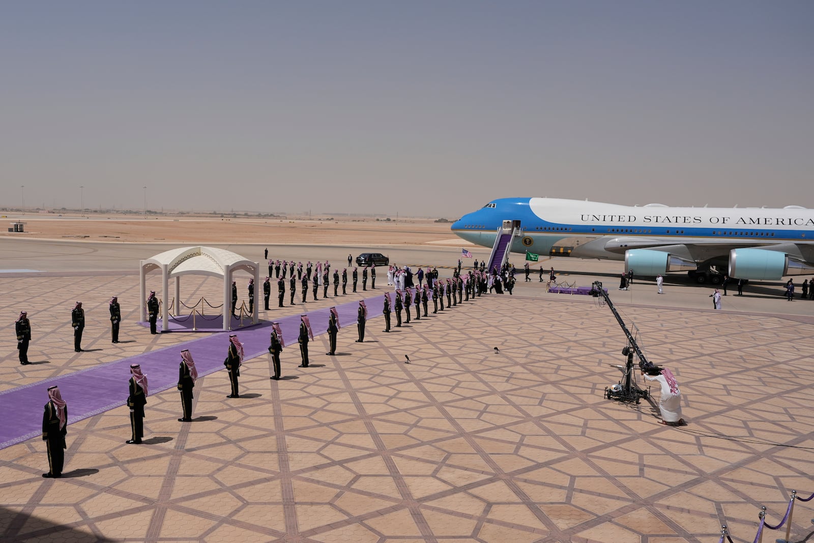 President Donald Trump walks with Saudi Crown Prince Mohammed bin Salman during an arrival ceremony at the Royal Terminal of King Khalid International Airport in Riyadh, Saudi Arabia, Tuesday, May 13, 2025