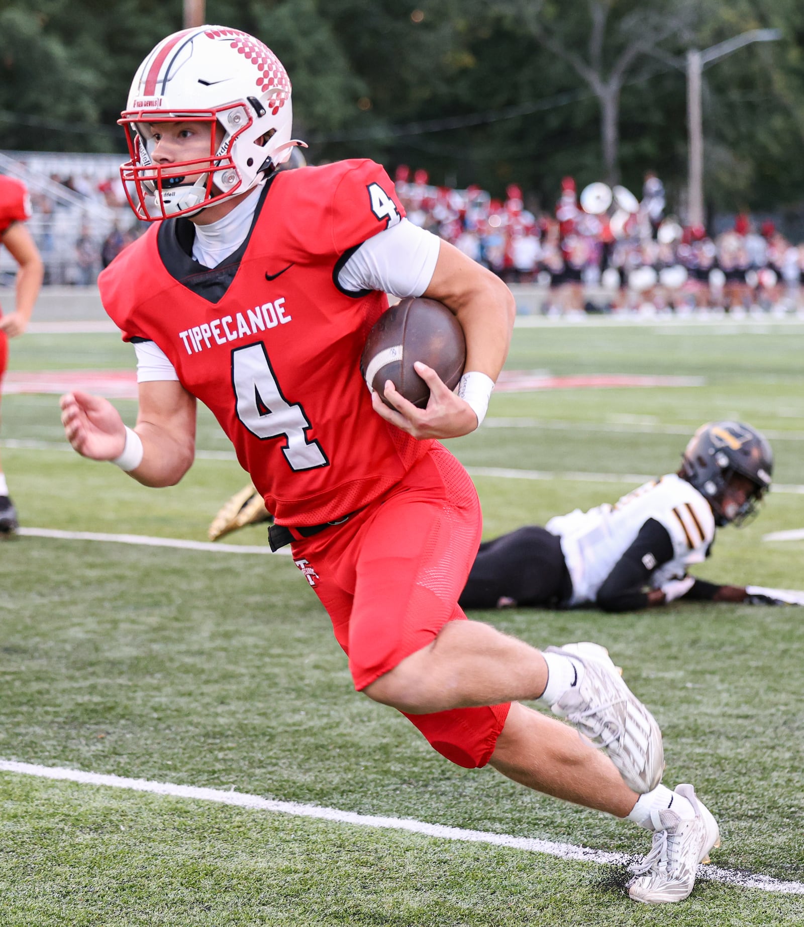 Tippecanoe junior quarterback Larkin Thomas runs during a Miami Valley League game against Sidney on Thursday, Sept. 25 at Tipp City Park. BRYANT BILLING / STAFF