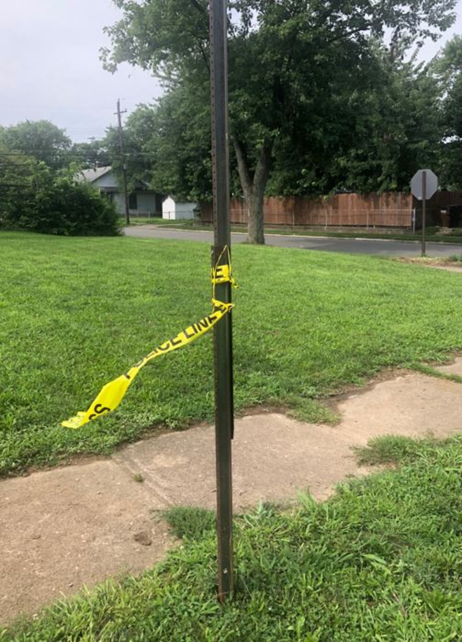 Police tape was wrapped around a bus stop sign this morning near Grand Avenue and Wilson Street. RICK McCRABB/STAFF