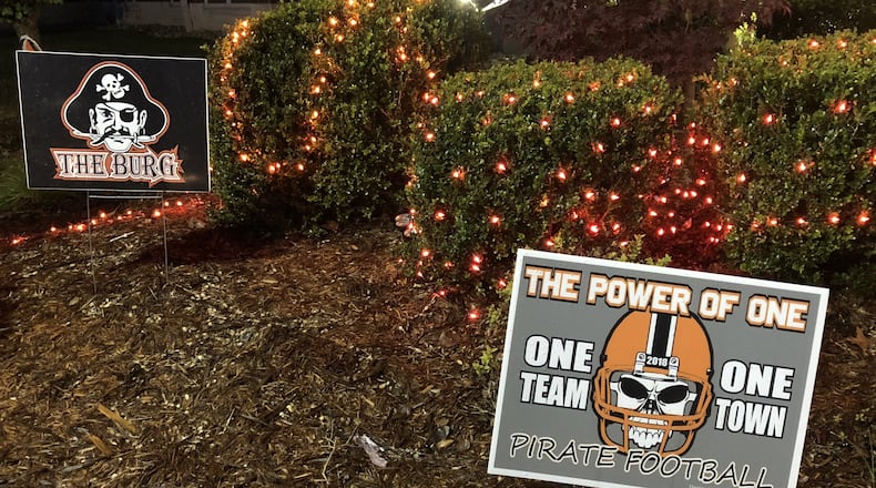 Multiple signs showing school spirit are on the grounds at Wheelersburg High School. RICK CASSANO/STAFF