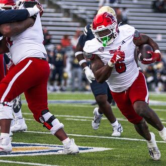 Miami RedHawks running back Jordan Brunson runs their ball during their game earlier this season against Akron. Miami won 20-7. MIAMI REDHAWKS ATHLETICS / CONTRIBUTED PHOTO