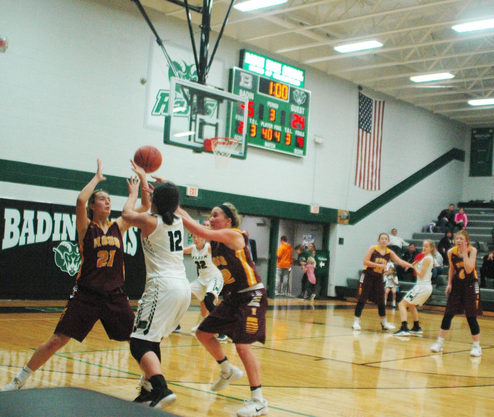 Badin’s Emma Adams (12) gets a pass through Ross defenders Korryne Justice (21) and Brooklyn Breaker (22) during Wednesday night’s game at Mulcahey Gym in Hamilton. Badin won 59-26. RICK CASSANO/STAFF
