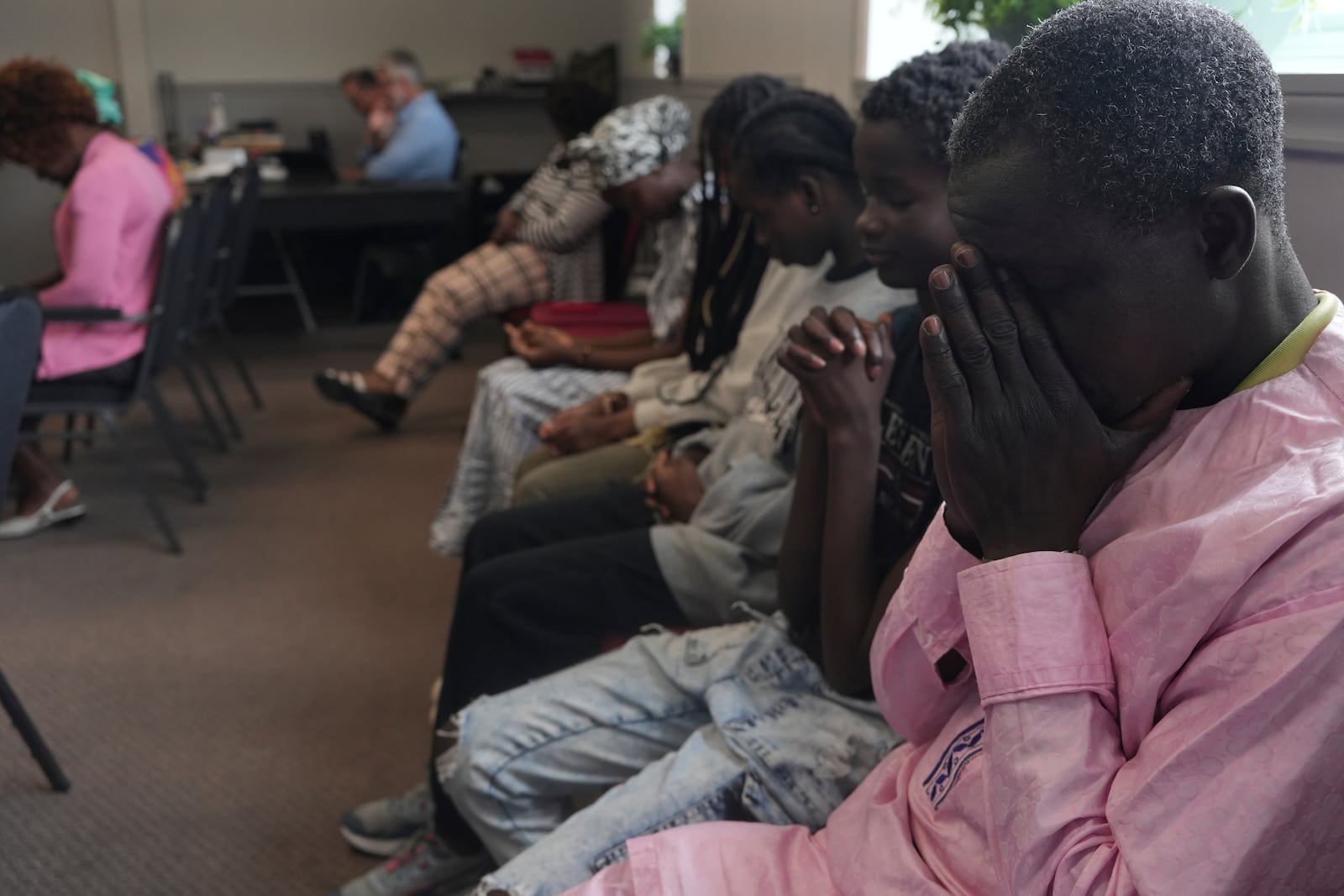 Worshippers pray during service at The Reformed Baptist Church in Saint Jerome, Quebec, Sunday, June 29, 2025. (AP Photo/Luis Andres Henao)