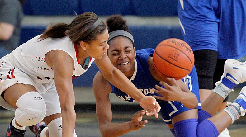 Lakota West’s Sarah Jones and Hamilton’s Cici Riggins (right) battle for a loose ball during the inaugural All-Butler County All-Star girls basketball game at the Hamilton Athletic Center on Apr. 15, 2017. JOURNAL-NEWS FILE PHOTO