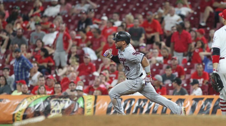 The White Sox’s Yoan Moncada triples to drive in three runs in the 12th inning against the Reds on Tuesday, July 3, 2018, at Great American Ball Park in Cincinnati.