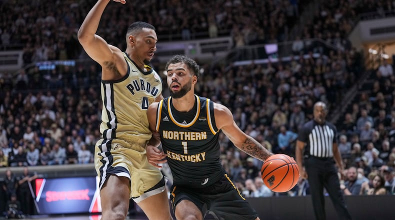 Northern Kentucky guard Trey Robinson (1) goes around Purdue forward Trey Kaufman-Renn (4) in the first half of an NCAA college basketball game in West Lafayette, Ind., Friday, Nov. 8, 2024. (AP Photo/AJ Mast)