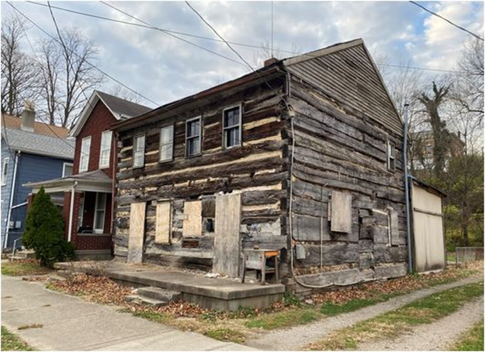 This log cabin dating to 1900 at 223-225 S. C St. is being offered for sale by the city of Hamilton. PROVIDED