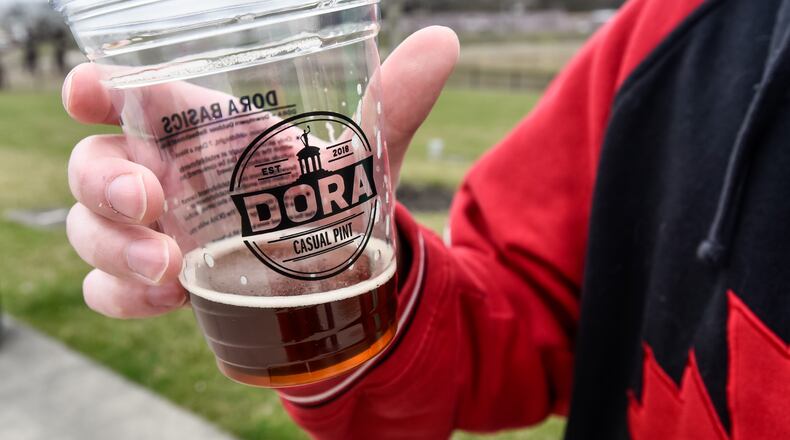 Designated outdoor refreshment area (DORA) districts have been a real boom for Butler County, and the state. NICK GRAHAM/FILE