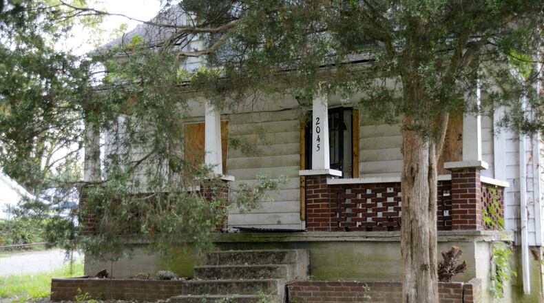 This home pictured on Sept. 25, 2017, on Fairfax Avenue is one of four homes Fairfield Twp. is set to demolish with through the Butler County land bank and the Hardest Hit Funds. The properties are owned by the township’s Community Improvement Corporation. MICHAEL D. PITMAN/STAFF
