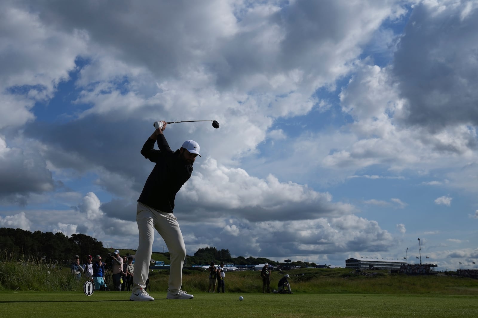 Scottie Scheffler of the United States plays off the 9th tee during the third round of the British Open golf championship at the Royal Portrush Golf Club, Northern Ireland, Saturday, July 19, 2025. (AP Photo/Jon Super)