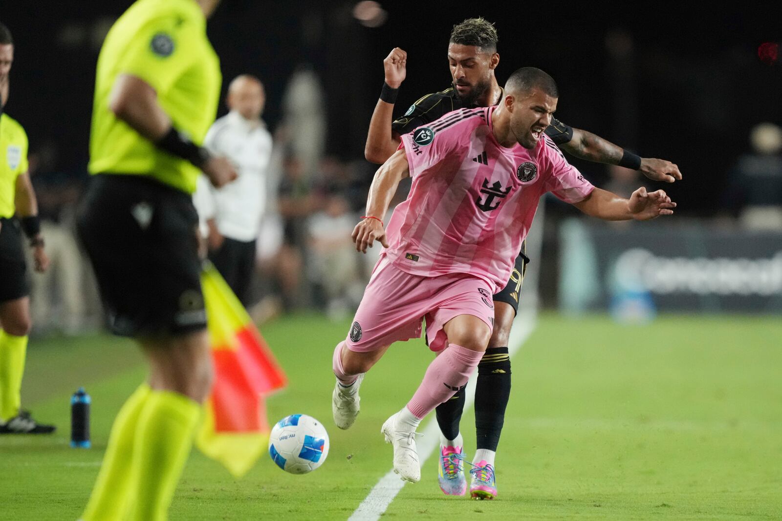 Inter Miami defender Marcelo Weigandt (57) collides with Los Angeles FC forward Denis Bouanga (99) during the first half of a CONCACAF Nations League Quarterfinal Match at Chase Stadium, Wednesday, April 9, 2025 in Fort Lauderdale, Fla. (AP Photo/Jim Rassol)