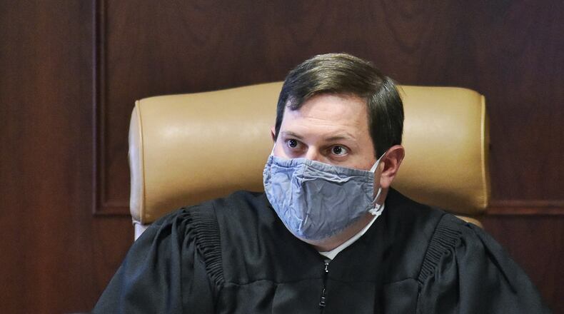 Dan Haughey takes the bench after being elected as new Butler County General Division Common Pleas Judge replacing Judge Charles Pater who could not run again due to age restrictions. NICK GRAHAM / STAFF