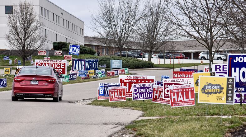 The Chamber of Commerce serving Middletown, Monroe, and Trenton and the Menard Family Center for Democracy at Miami University are relaunching the Candidate College, a program designed to equip individuals with additional knowledge to volunteer or run for local office. Pictured are campaign signs at the Butler County Board of Elections in Hamilton during the 2020 primary election. NICK GRAHAM/FILE
