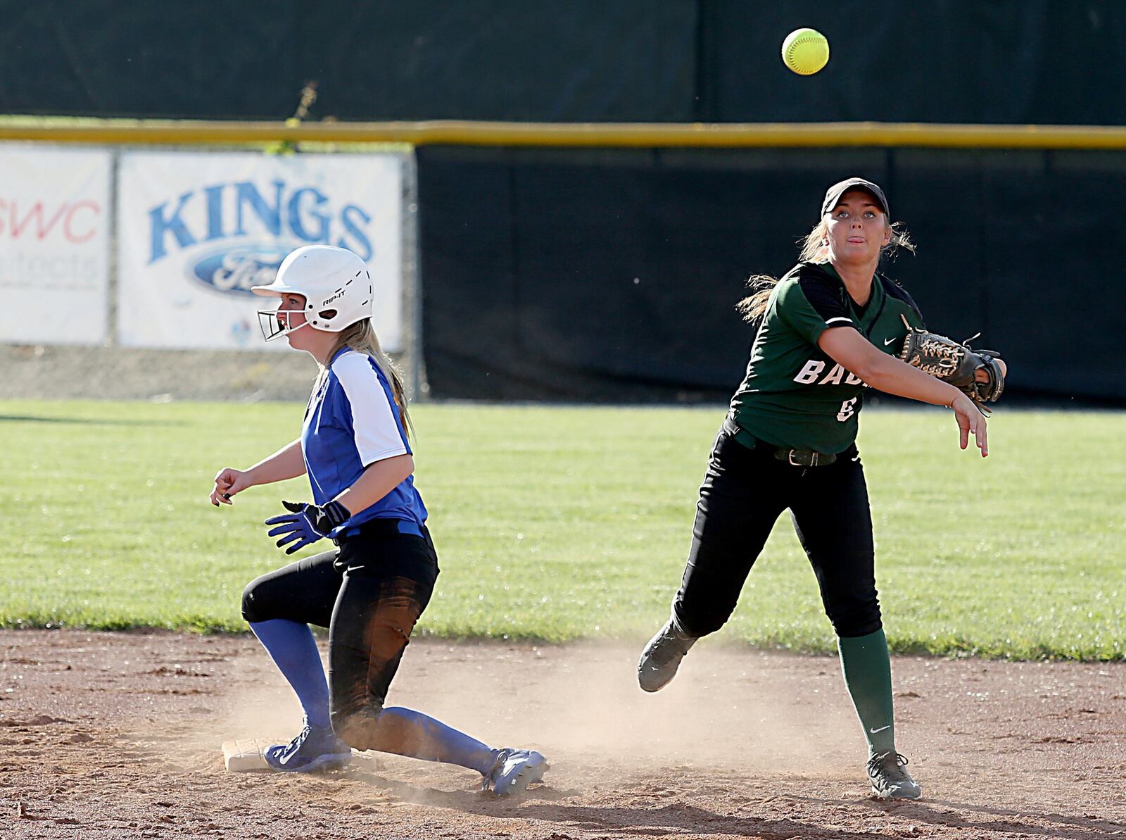 Badin shortstop Shelby Schmitt gets the out on Clermont Northeastern’s Kylie Dollenmeyer and turns a double play Monday during a Division III district title game at Kings. CONTRIBUTED PHOTO BY E.L. HUBBARD