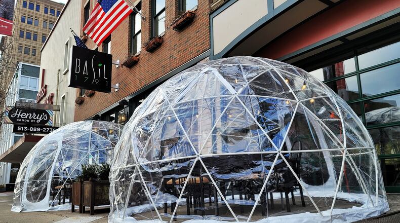 Basil 1791 on High Street in Hamilton has installed igloos for outdoor dining on the sidewalk in front of the restaurant. NICK GRAHAM / STAFF