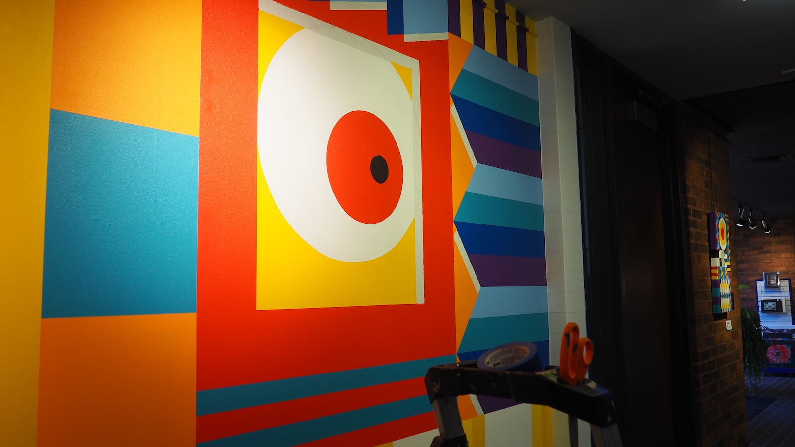 The Middletown Art Center's rear hallway now has a permanent mural from Cincinnati-based artist Chase Melendez. BRYN DIPPOLD/STAFF