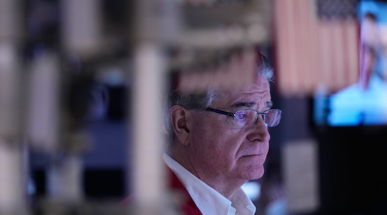 Daniel Kryger works on the floor at the New York Stock Exchange in New York, Friday, Jan. 9, 2026. (AP Photo/Seth Wenig)