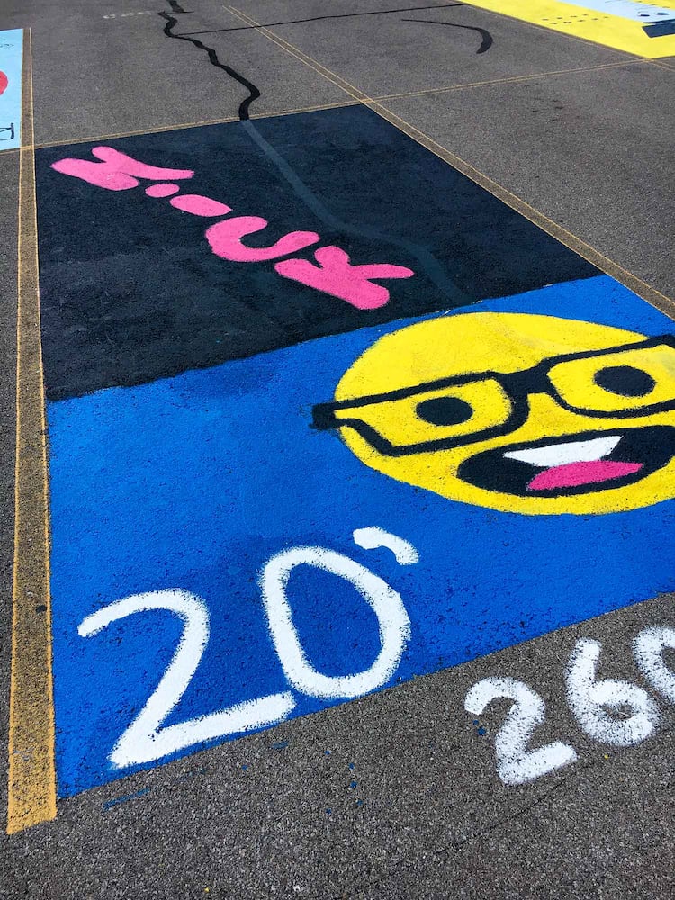 PHOTOS Lakota East seniors paint parking spots