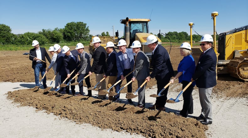 Kroger broke ground on its new 335,000-square-foot high-tech customer fulfillment center at 6266 Hamilton Lebanon Road in Monroe Wednesday, June 12, 2019. The automated warehouse is a collaboration between Kroger and Ocado, one of the world s largest dedicated online grocery retailers. Pictured left to right are left to right are Yael Cosset, Kroger Senior Vice President and Chief Information Officer; Jessica Adelman, Kroger Group Vice President, Corporate Affairs; Scott Hays, Kroger Cincinnati-Dayton Division President; Alex Tosolini, Kroger Senior Vice President, New Business Development; Robert Clark, Kroger Senior Vice President of Supply Chain, Manufacturing, and Sourcing; David Hardiman-Evans, Senior Vice President, North America, Ocado Solutions; Todd Schell, Senior Vice President, Industrial, Ryan Companies; Joshua Tovey, Southwest Ohio Regional Liaison, Lt. Governor; Tim Massa, Kroger Senior Vice President and Chief People Officer; Monroe council members Christina McElfresh and Todd Hickman. ERIC SCHWARTZBERG/STAFF