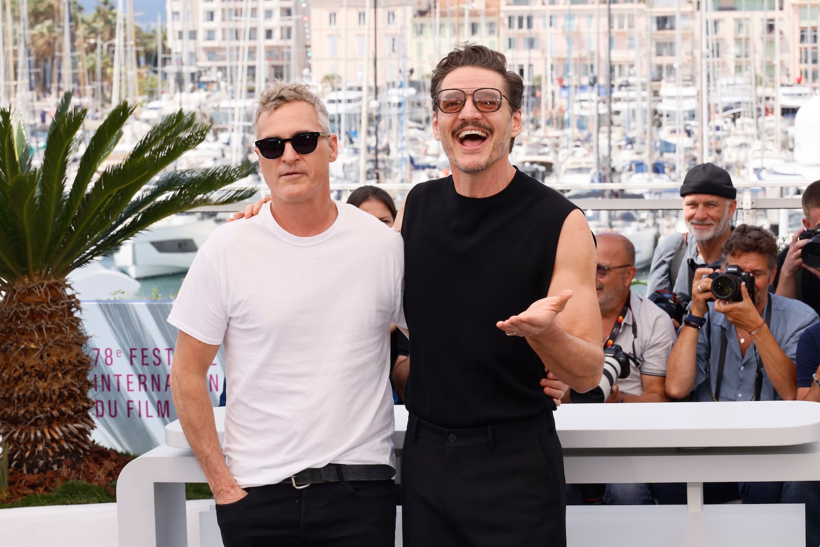Joaquin Phoenix, left, and Pedro Pascal pose for photographers at the photo call for the film 'Eddington' at the 78th international film festival, Cannes, southern France, Saturday, May 17, 2025. (Photo by Joel C Ryan/Invision/AP)