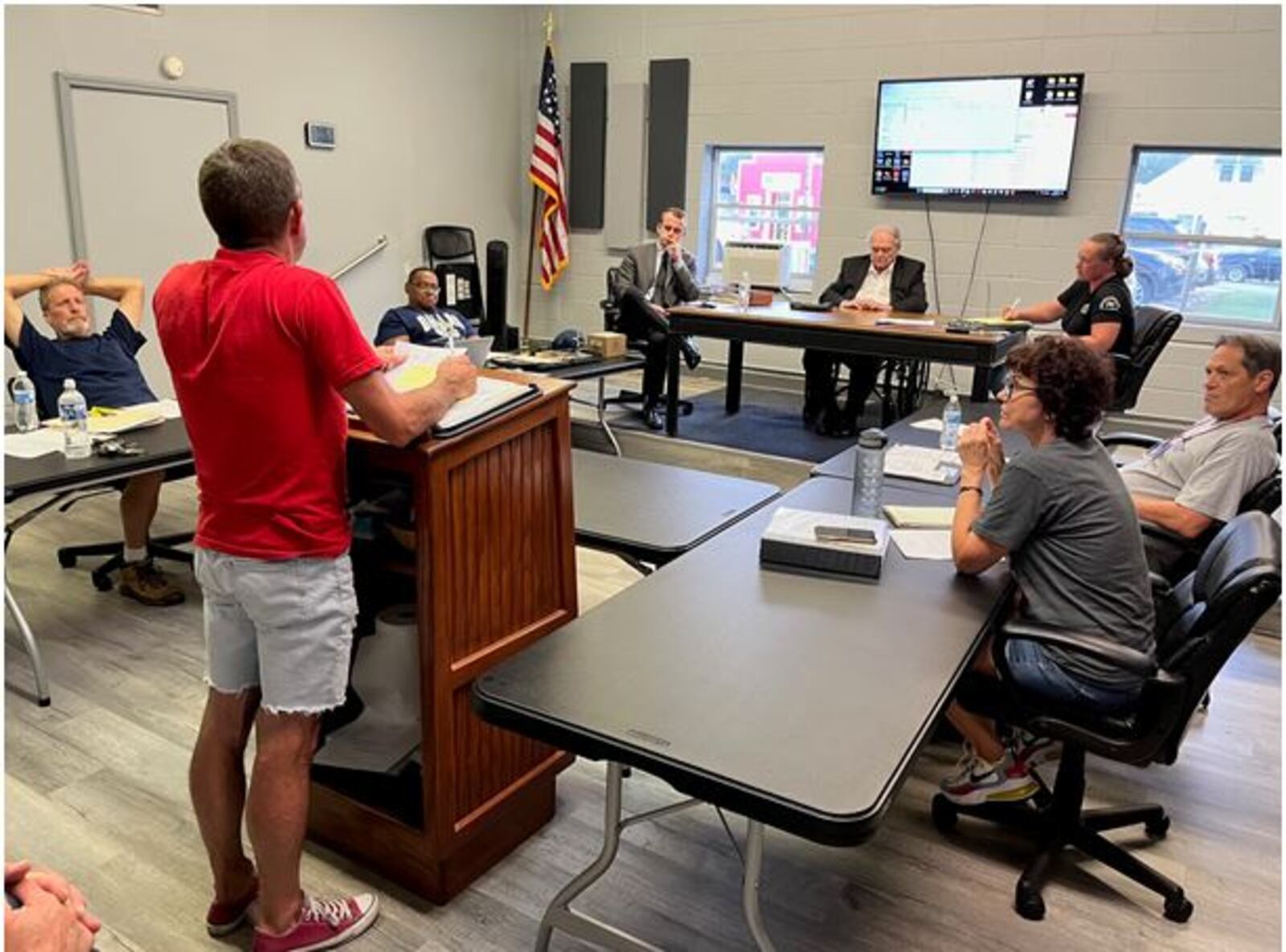 Harveysburg Village Council hears a report during its meeting on Monday, Sept. 11, 2023. At that meeting, council adopted a new building permit fee schedule that goes into effect on Oct. 11, 2023.  ED RICHTER/STAFF