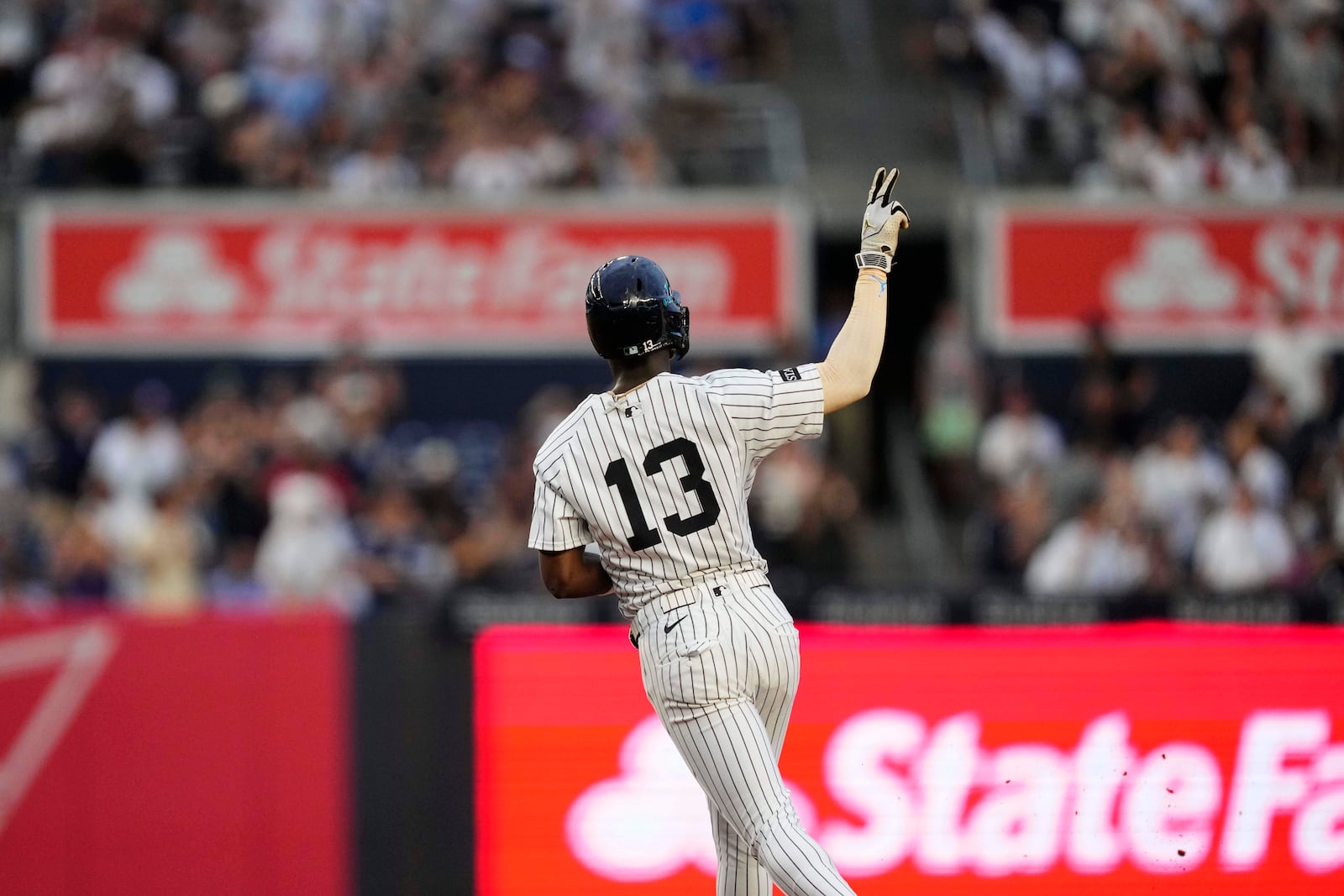 New York Yankees' Jazz Chisholm Jr. (13) runs the bases after hitting a home run during the third inning of a baseball game against the Seattle Mariners, Wednesday, July 9, 2025, in New York. (AP Photo/Yuki Iwamura)