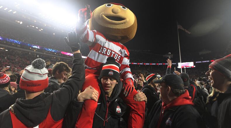 Brutus the Buckeye gets carried off the field after Ohio States victory against Penn State on Saturday, Oct. 28, 2017, at Ohio Stadium in Columbus. David Jablonski/Staff