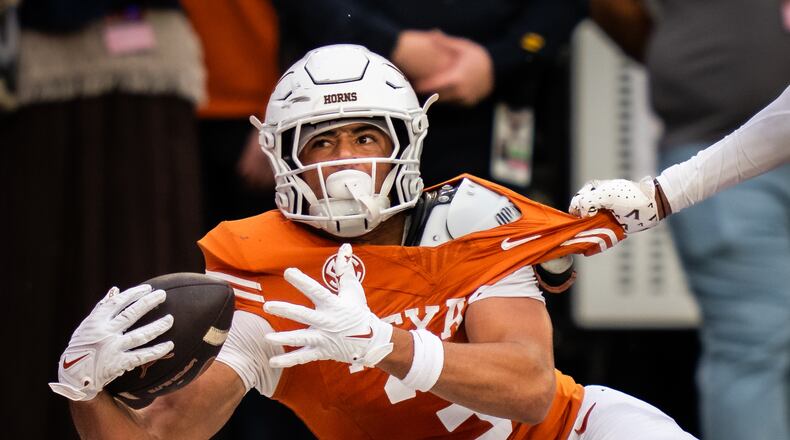 Texas wide receiver Emmett Mosley V is unable to hold onto a pass in the end zone during the second half of an NCAA college football game against Vanderbilt, Saturday, Nov. 1, 2025, in Austin, Texas. (Sara Diggins/Austin American-Statesman via AP)